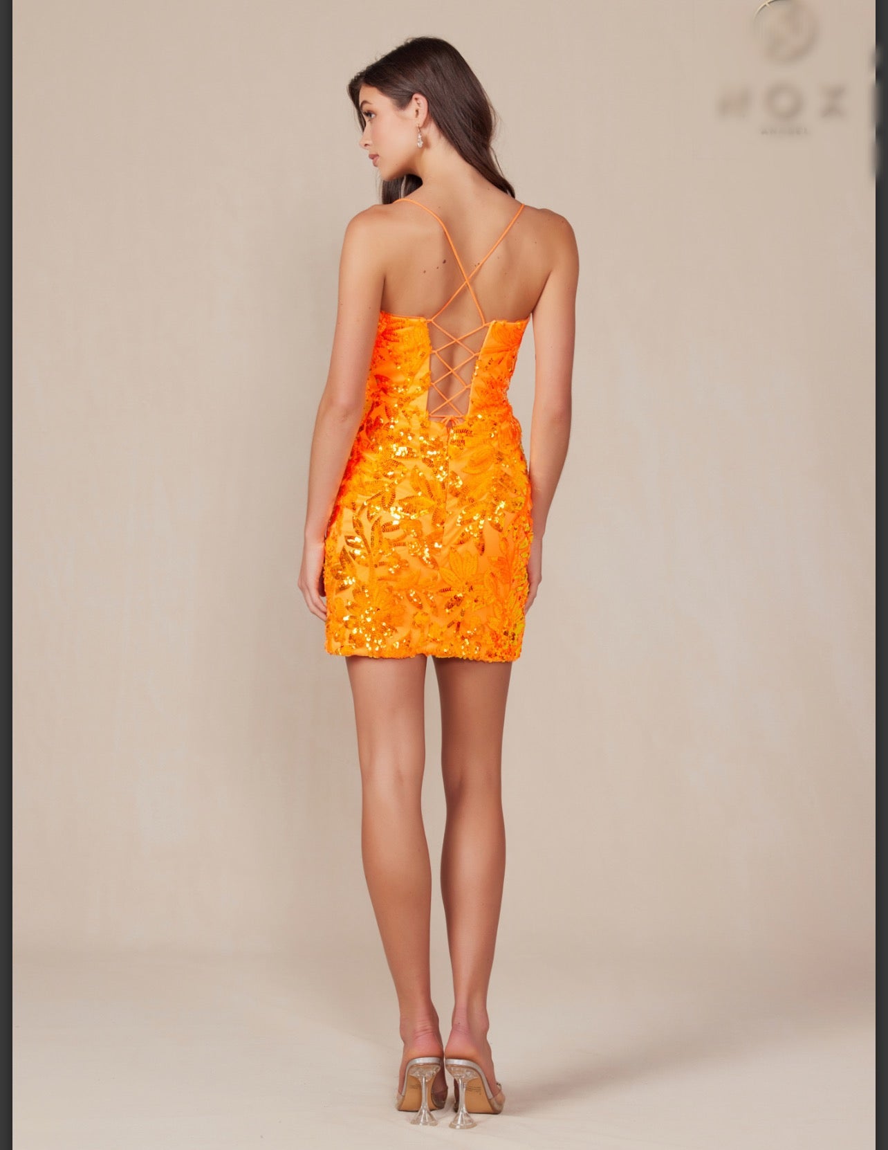 Orange Sequin short dress that features a plunging V-neckline.